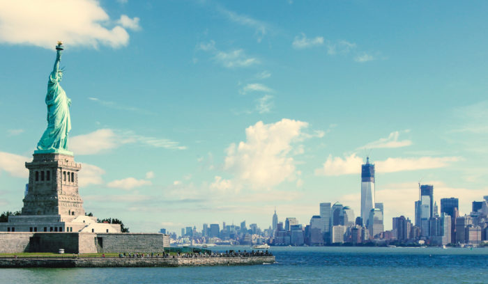 Statue of Liberty with U.S. skyline in the background for cross-border shipping and export strategy solutions