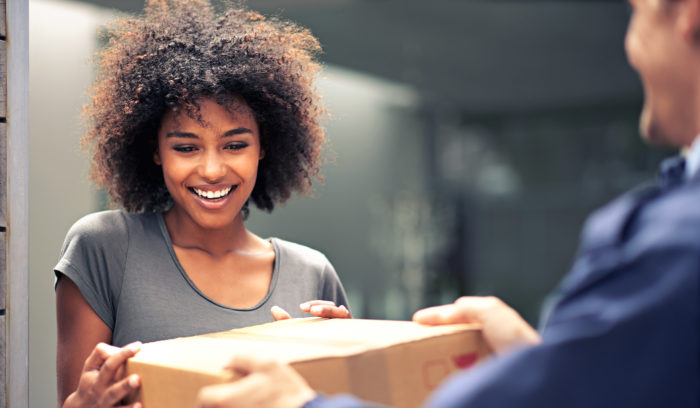 happy woman receiving same-day delivery