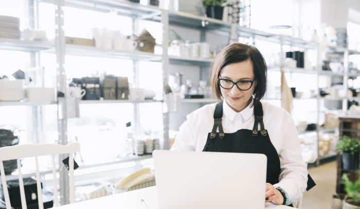 woman on laptop using online marketing strategies