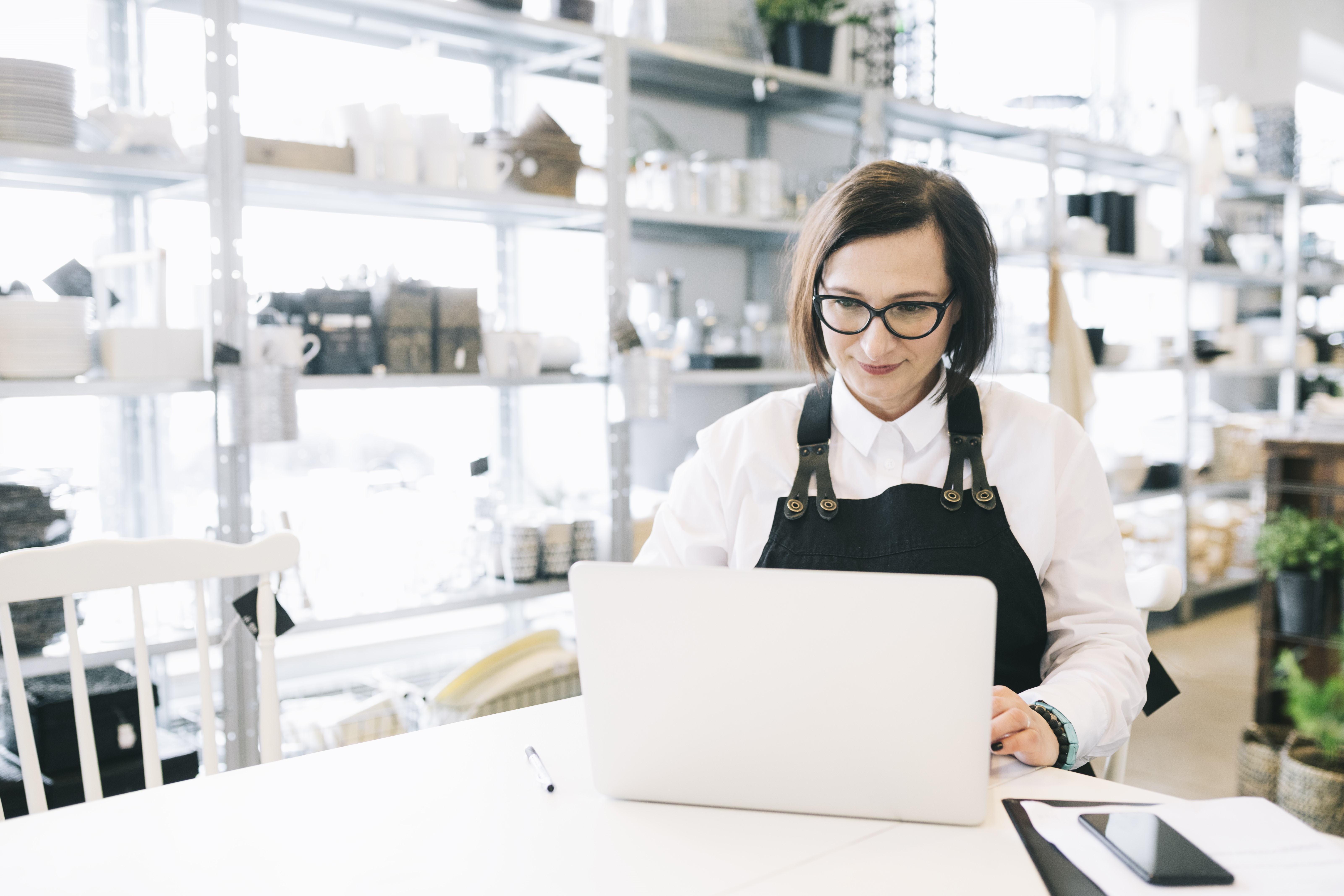 woman on laptop using online marketing strategies