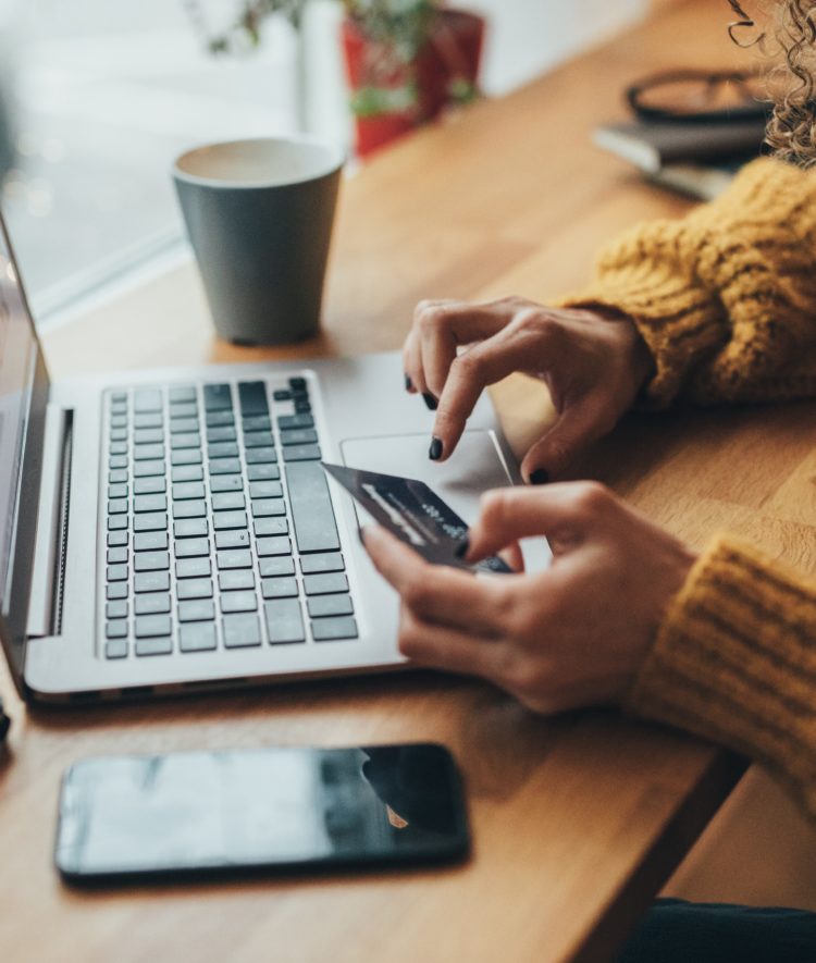 woman on computer shopping Black Friday Cyber Monday deals