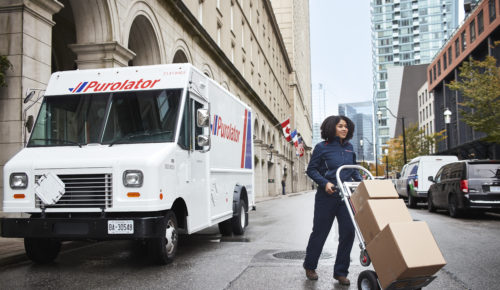 Purolator woman courier delivering online shopping parcels