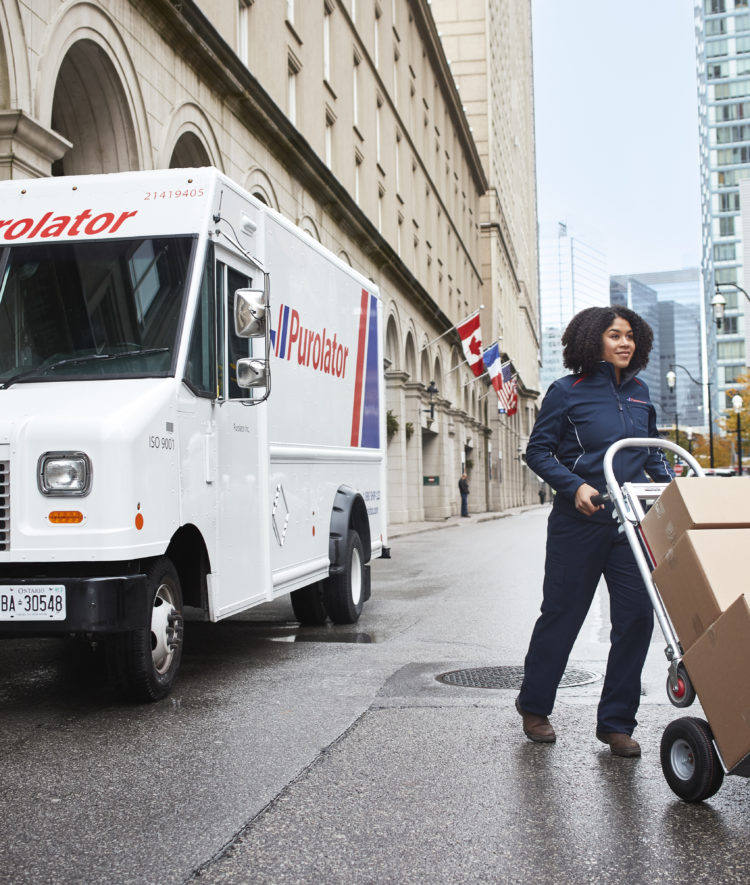 Purolator woman courier delivering online shopping parcels