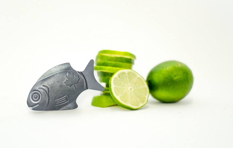 Lucky Iron Fish on display with limes