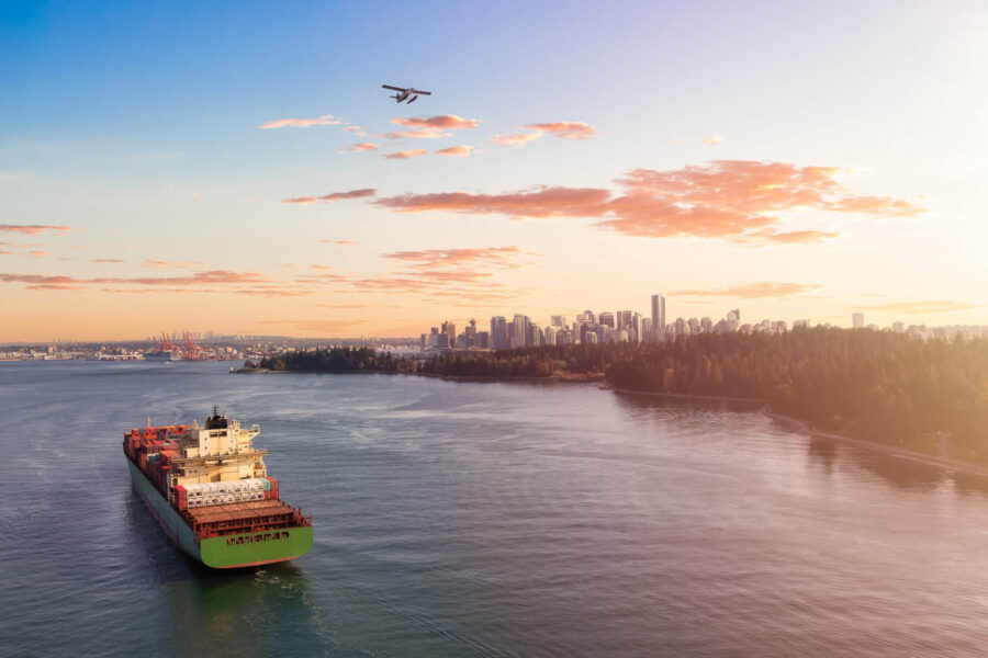 Plane flying over city landscape as part of direct shipping strategy