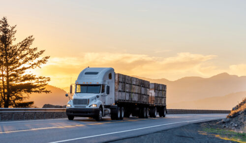 transport truck driving during sunset