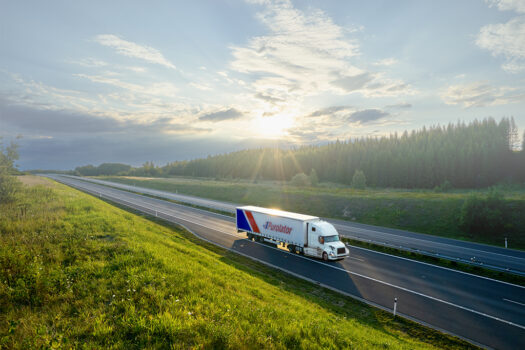 Freight Truck driving through roads