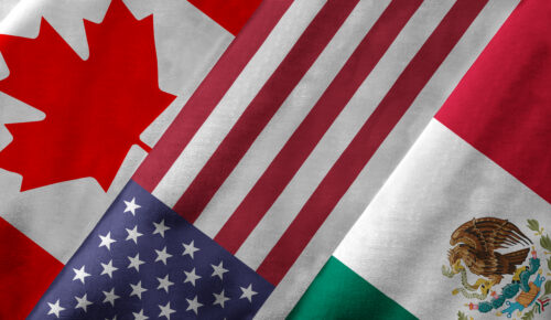 Closeup of the flags of the North American Free Trade Agreement NAFTA members on textile texture. NAFTA is the world's largest trade bloc and the member countries are Canada, United States and Mexico. 3D rendering with detailed textured grunge effect on closeup.