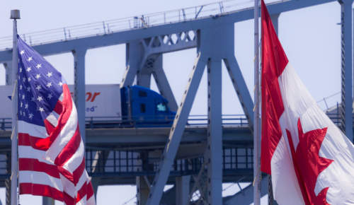 Purolator freight truck crossing bridge border